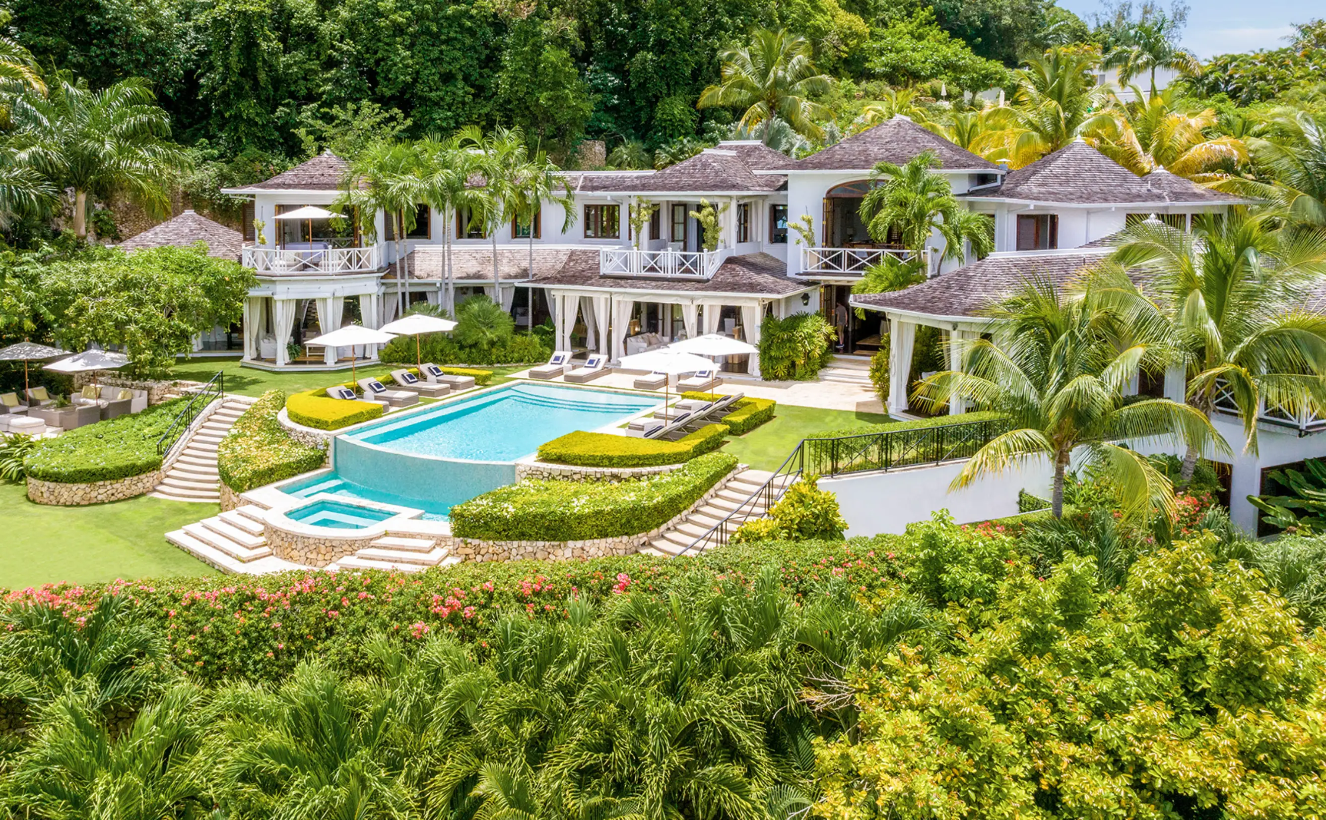 Luxury tropical villa with pool and palm trees