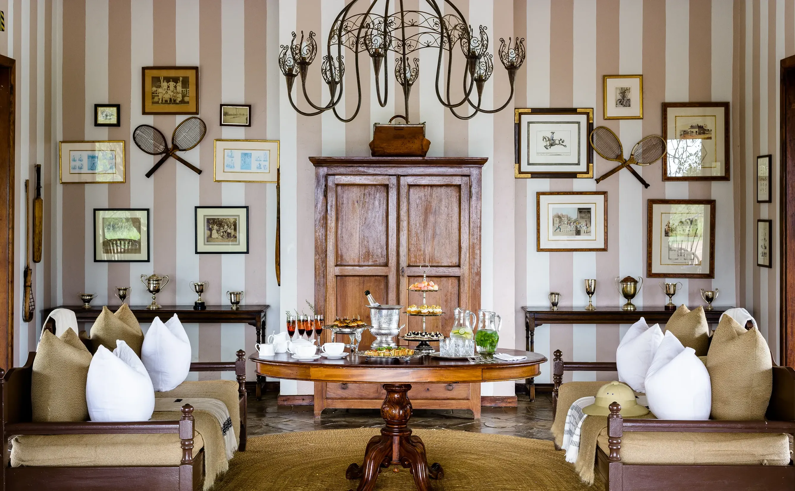 Symmetrical vintage sitting room with round refreshment table