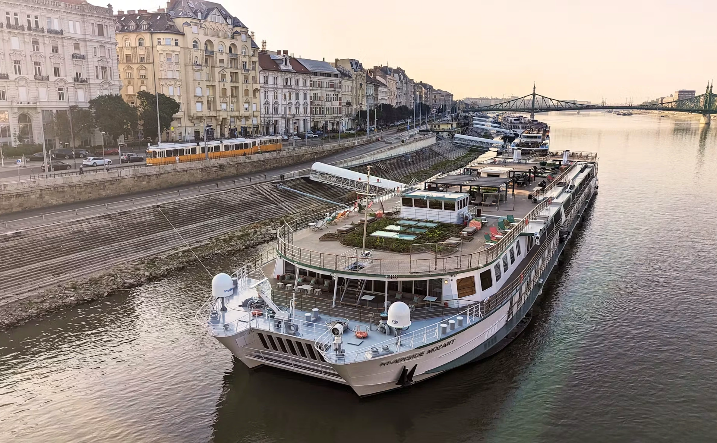 River cruise ship docked along European city promenade